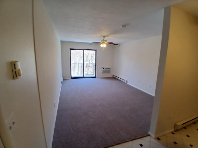 spare room with a ceiling fan, a baseboard radiator, carpet, and a wall mounted AC