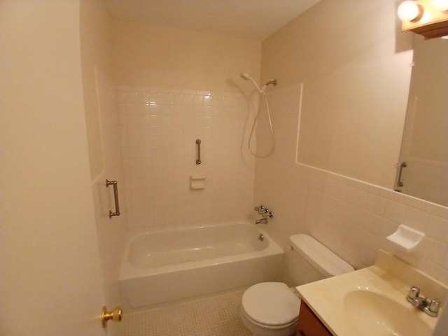 bathroom with shower / bathtub combination, toilet, vanity, tile walls, and decorative backsplash