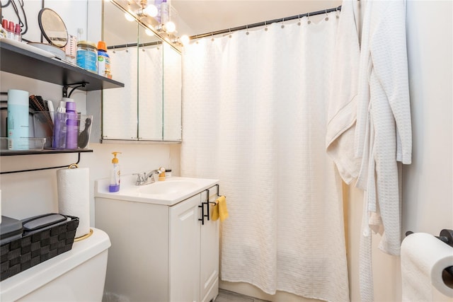 full bath featuring curtained shower, vanity, and toilet