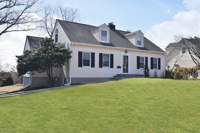cape cod-style house featuring a chimney, a front yard, and a shingled roof