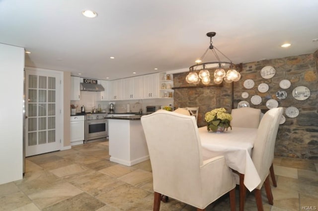 dining room with recessed lighting