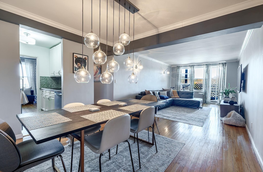 1296 Midland Ave Unit E6, Yonkers, NY 10704 - dining space featuring ornamental molding, plenty of natural light, and wood finished floors