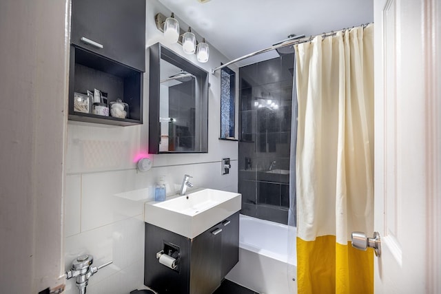 full bath featuring shower / bathtub combination with curtain, tile walls, and vanity