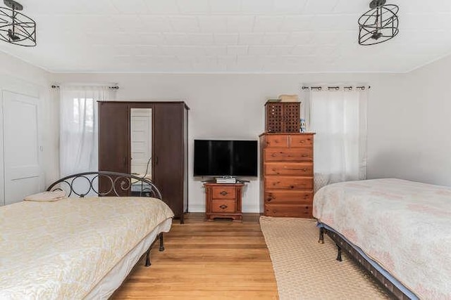 bedroom featuring light wood-style floors