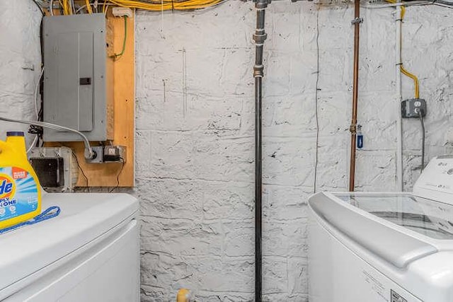 laundry room featuring laundry area, separate washer and dryer, and electric panel