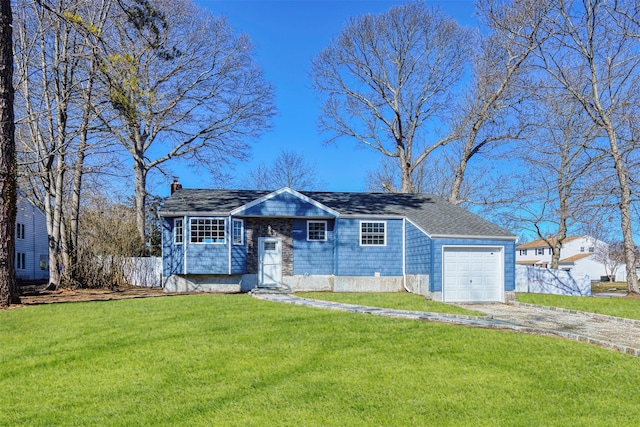 view of front facade with driveway, a garage, a chimney, fence, and a front lawn