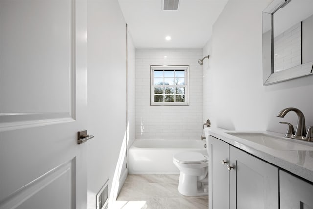 bathroom with toilet, visible vents, tub / shower combination, and vanity