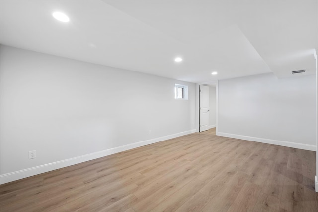 spare room featuring baseboards, recessed lighting, visible vents, and light wood-style floors