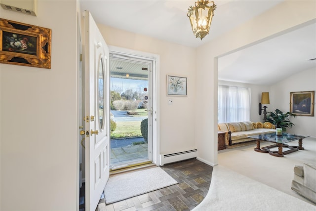 foyer with vaulted ceiling, baseboards, visible vents, and baseboard heating