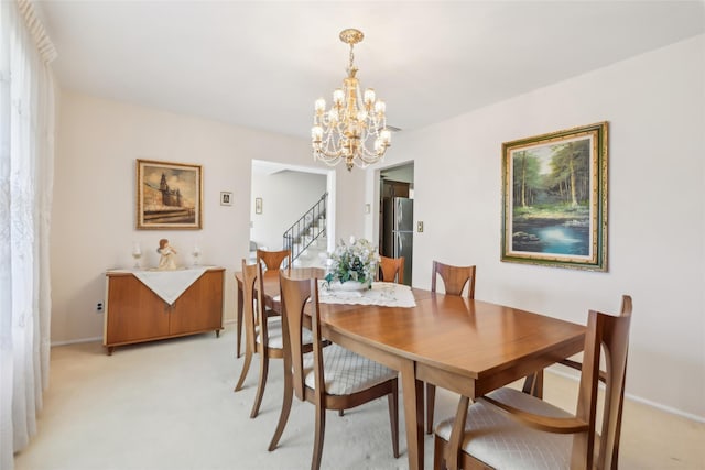 dining area featuring stairway, light colored carpet, baseboards, and a chandelier