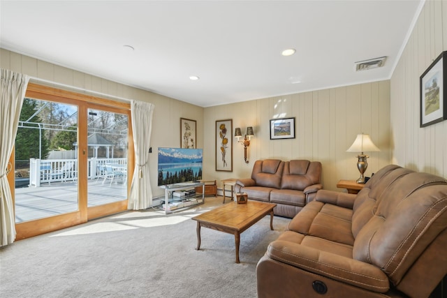 carpeted living area with visible vents, recessed lighting, and baseboard heating