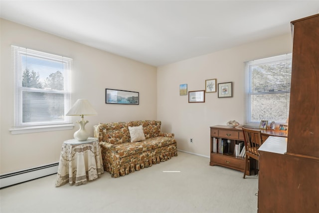 living area featuring baseboards, carpet floors, and baseboard heating