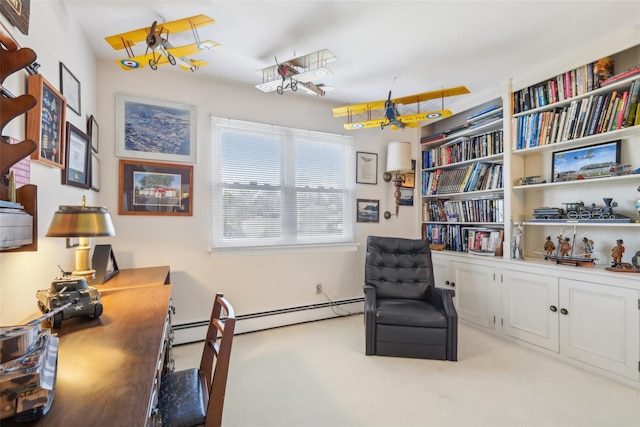 sitting room with a baseboard heating unit