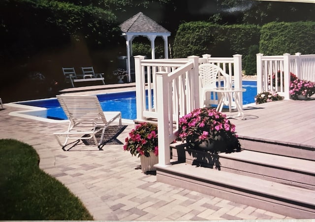 outdoor pool featuring a gazebo