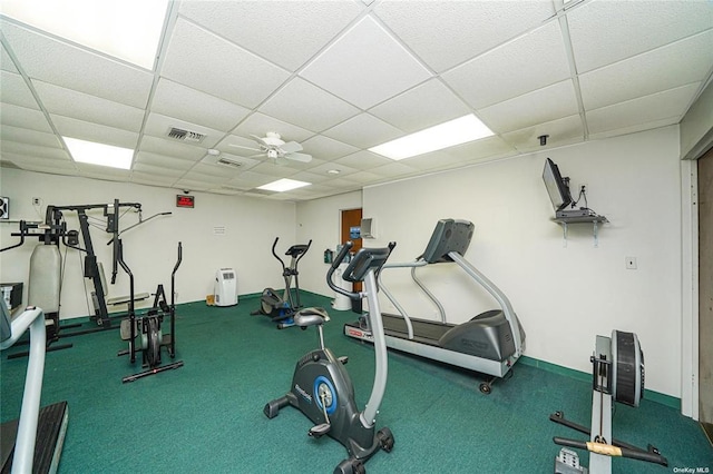 gym featuring a paneled ceiling and visible vents