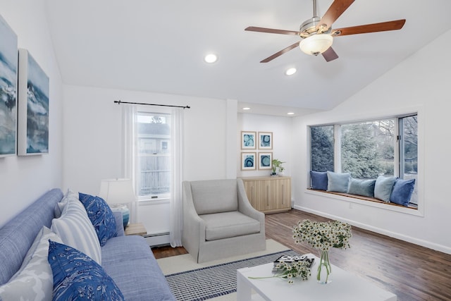 living area featuring lofted ceiling, a baseboard radiator, recessed lighting, wood finished floors, and baseboards