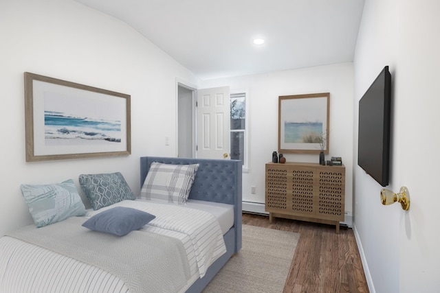 bedroom with baseboards, baseboard heating, wood finished floors, and recessed lighting