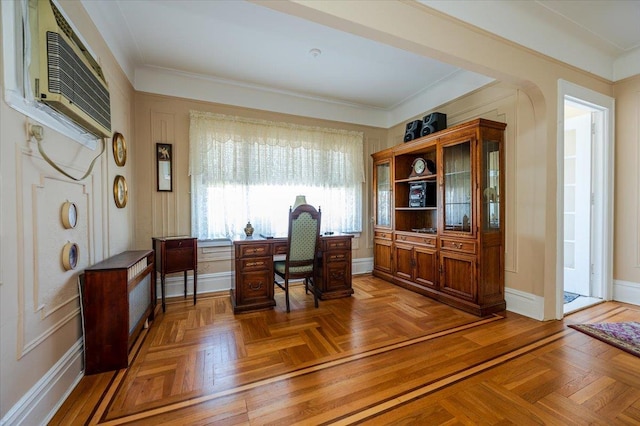 office area with baseboards, crown molding, and a wall mounted air conditioner