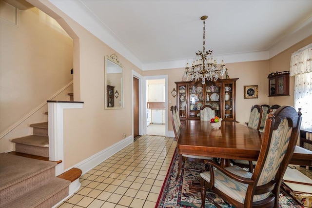 dining area with crown molding, stairway, an inviting chandelier, light tile patterned flooring, and baseboards