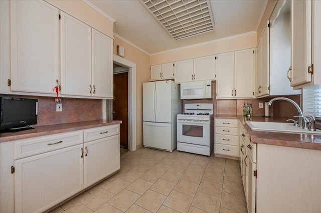 kitchen with white appliances, decorative backsplash, crown molding, white cabinetry, and a sink