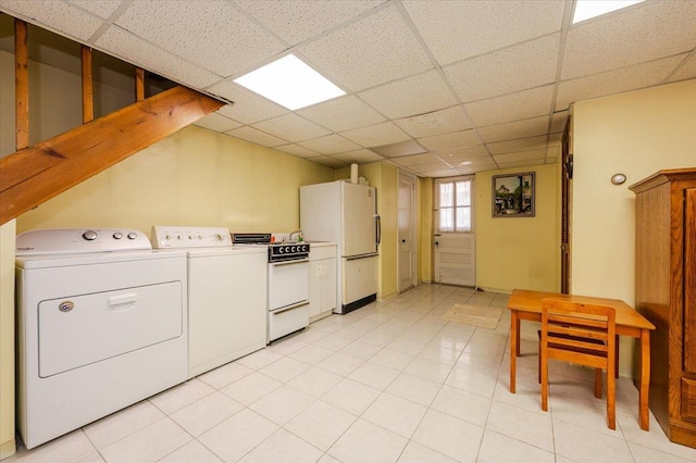 washroom with washing machine and dryer and laundry area