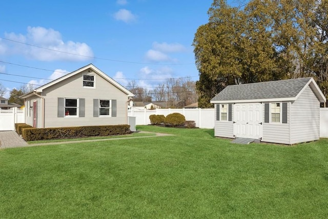 view of yard with a fenced backyard and an outdoor structure