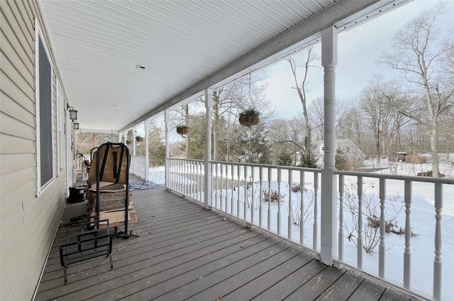 view of snow covered deck