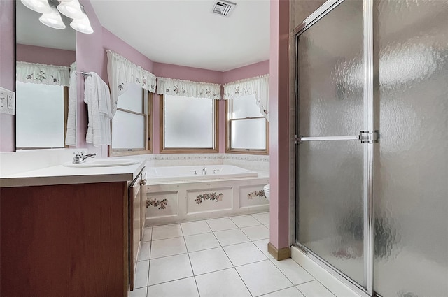 full bathroom featuring a garden tub, visible vents, a stall shower, vanity, and tile patterned flooring