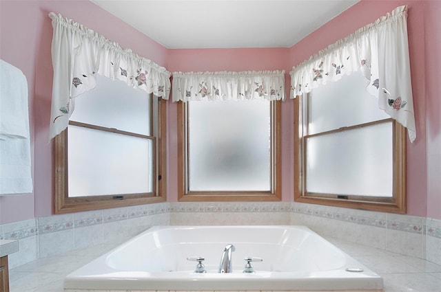 full bathroom featuring a bath and vanity