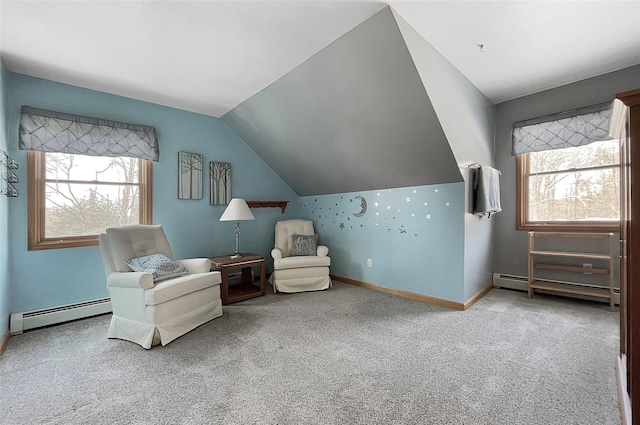 sitting room featuring carpet, a baseboard heating unit, and a wealth of natural light