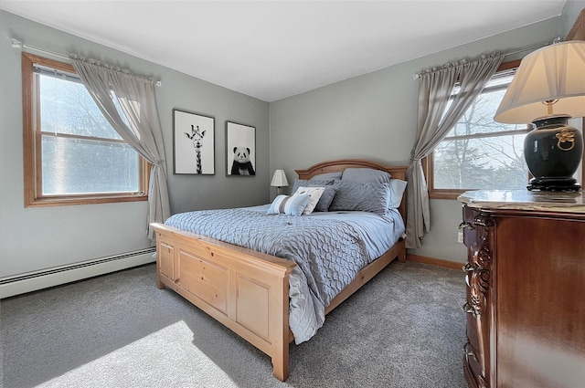 bedroom featuring baseboards, a baseboard heating unit, and dark colored carpet