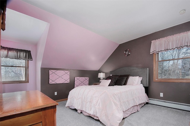 carpeted bedroom with baseboard heating, vaulted ceiling, and baseboards