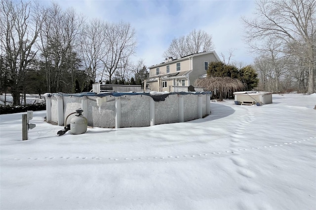 exterior space featuring a pool and a jacuzzi