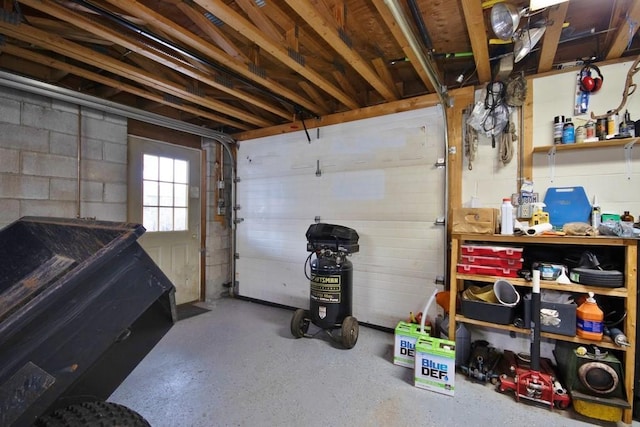 garage with concrete block wall