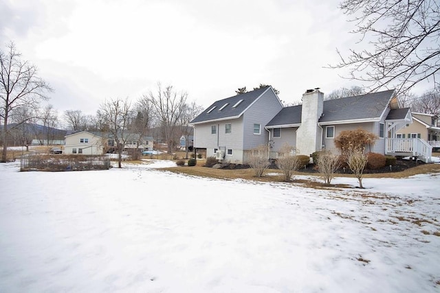 exterior space featuring a residential view and a chimney