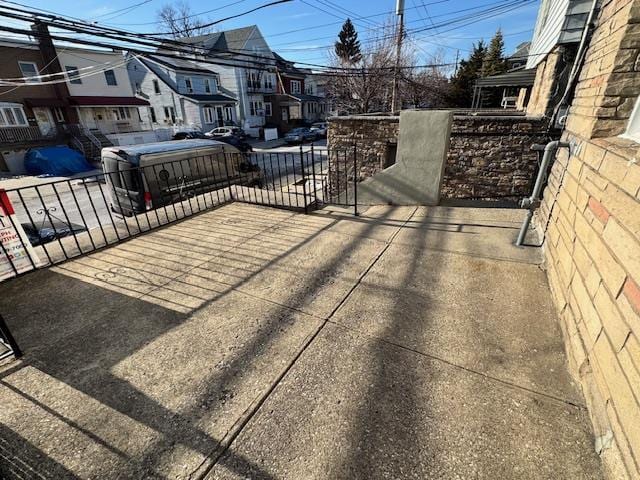 exterior space with fence and a residential view