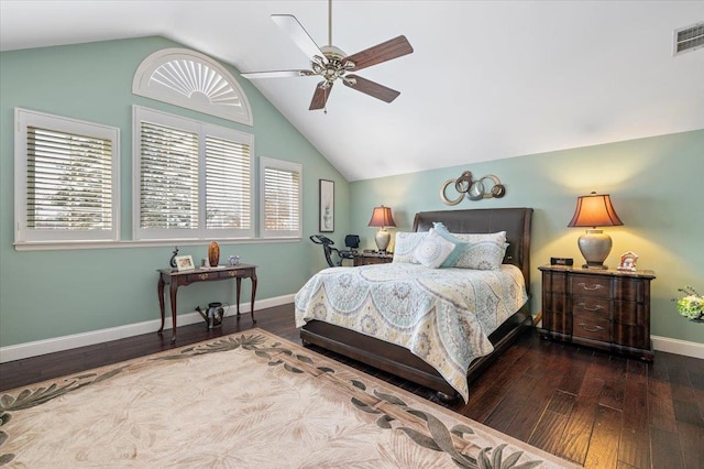 bedroom featuring dark wood finished floors, visible vents, vaulted ceiling, ceiling fan, and baseboards