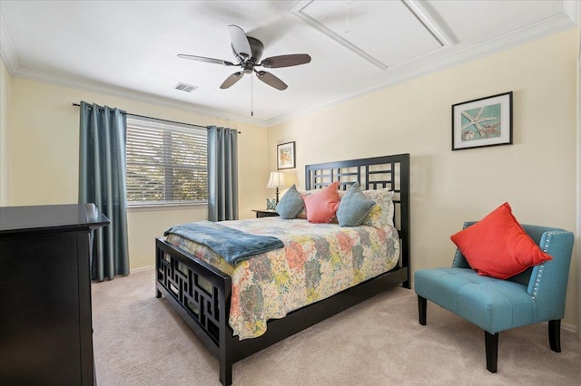 bedroom with attic access, light colored carpet, ornamental molding, and visible vents