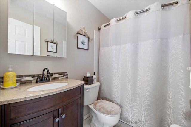 full bathroom featuring toilet and vanity