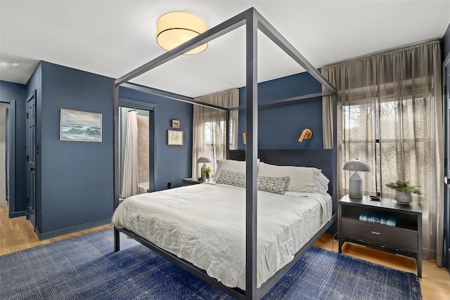 bedroom featuring wood finished floors