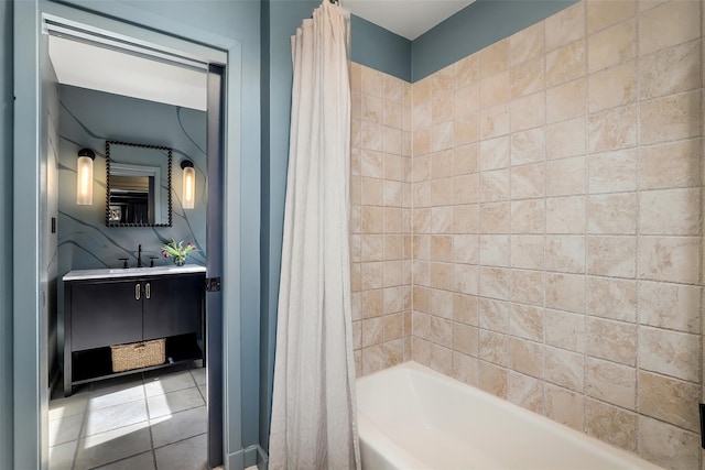 full bath with tile patterned floors, shower / bath combo with shower curtain, and vanity