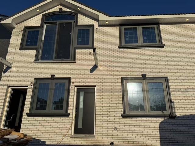 view of front of house featuring brick siding