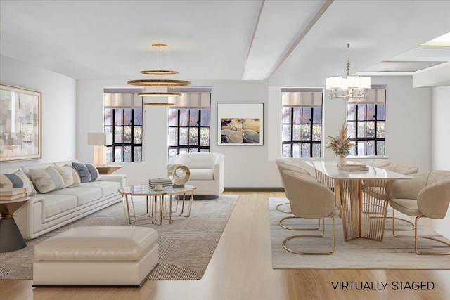 living room featuring light wood-style flooring and a chandelier