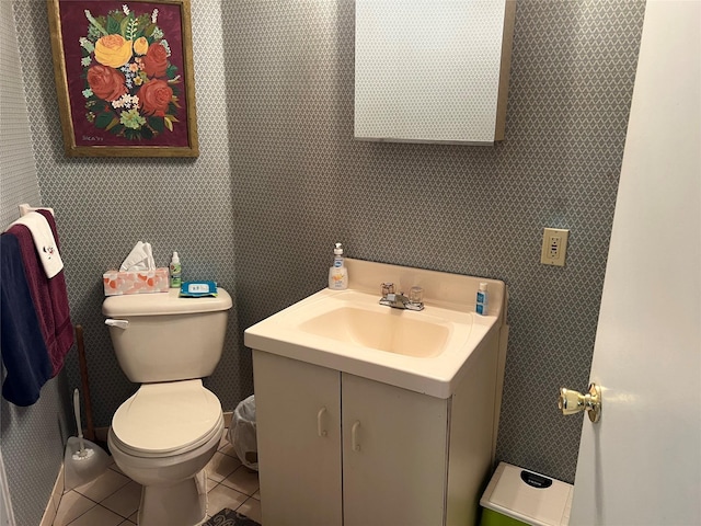 bathroom featuring tile patterned flooring, vanity, toilet, and wallpapered walls