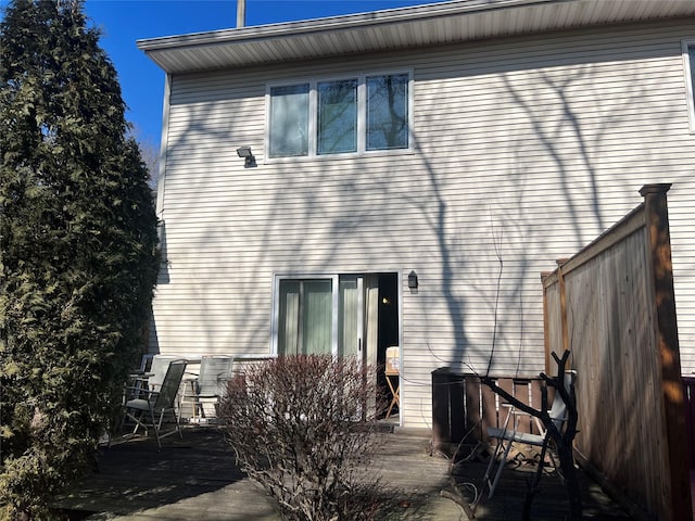 rear view of property featuring a deck