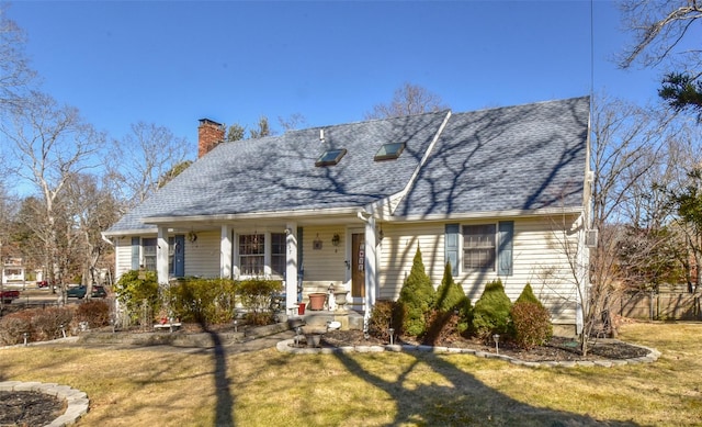 cape cod home featuring covered porch, a front lawn, and a chimney