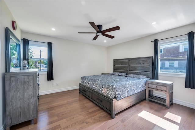 bedroom featuring recessed lighting, baseboards, and wood finished floors