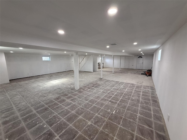 below grade area with tile patterned floors and recessed lighting