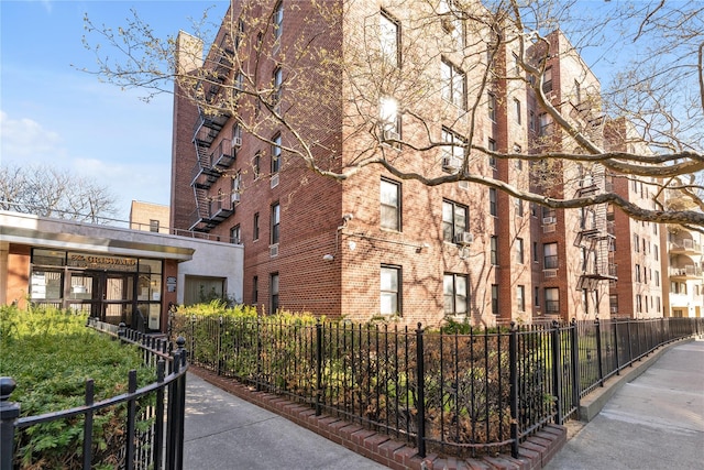 view of building exterior featuring a fenced front yard