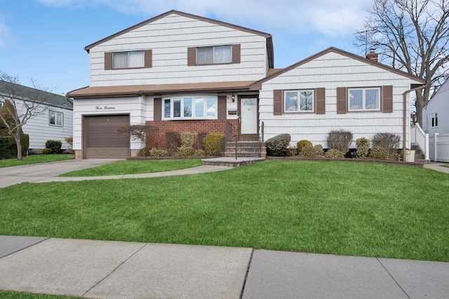 view of front of home featuring concrete driveway, a chimney, an attached garage, a front yard, and brick siding